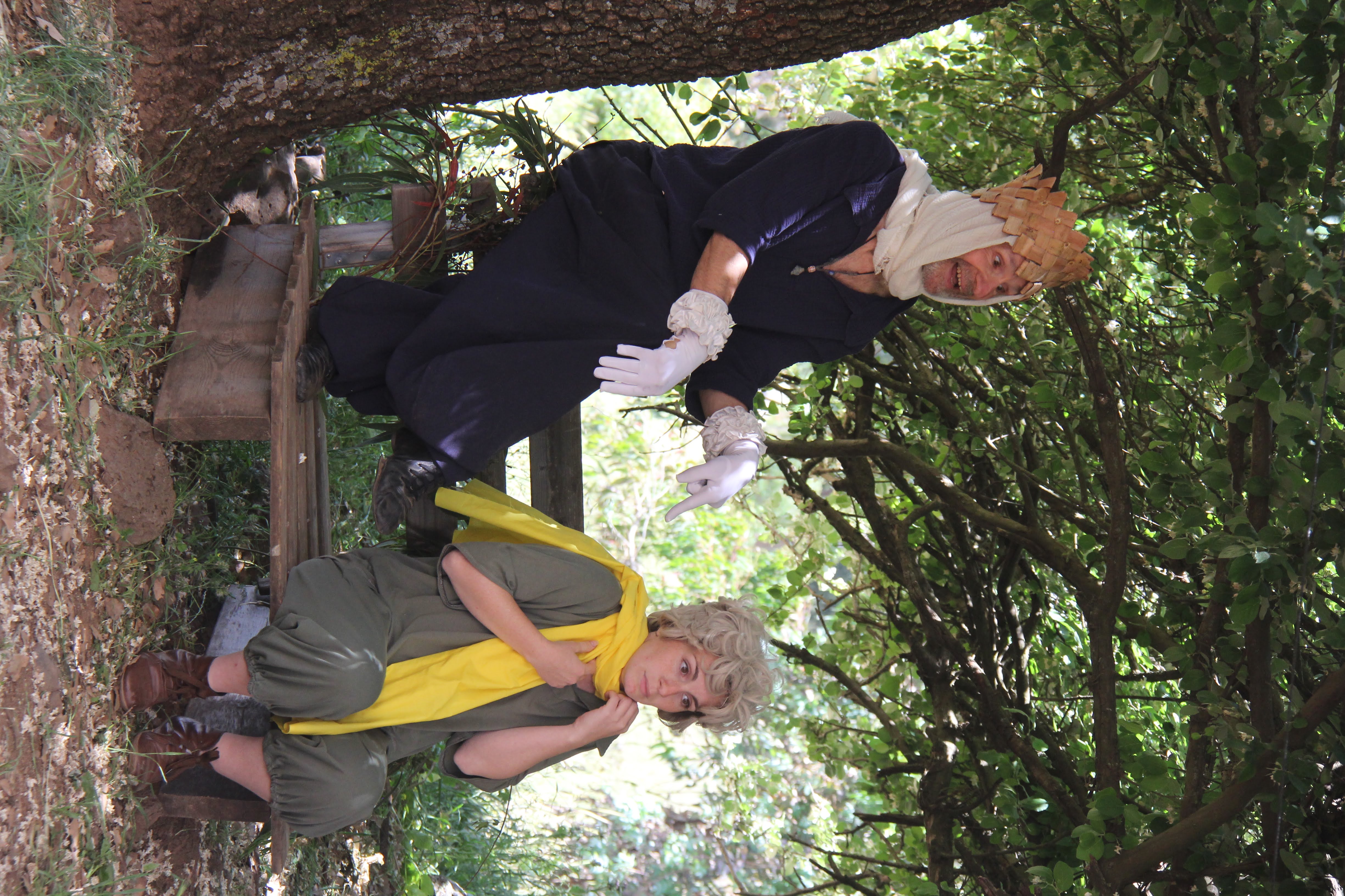 Actors performing on a wooden bench